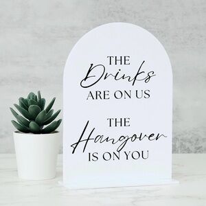 Black and white Wedding sign. The drinks are on us the hangover is on you